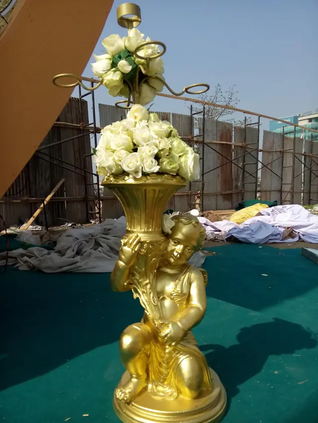 Gold FRP urn with flowers