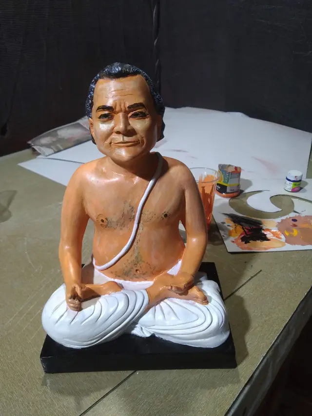 Seated FRP figure
