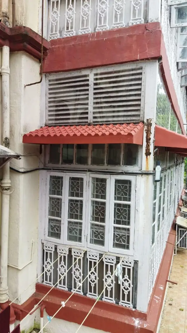 Red FRP chajja on a heritage building